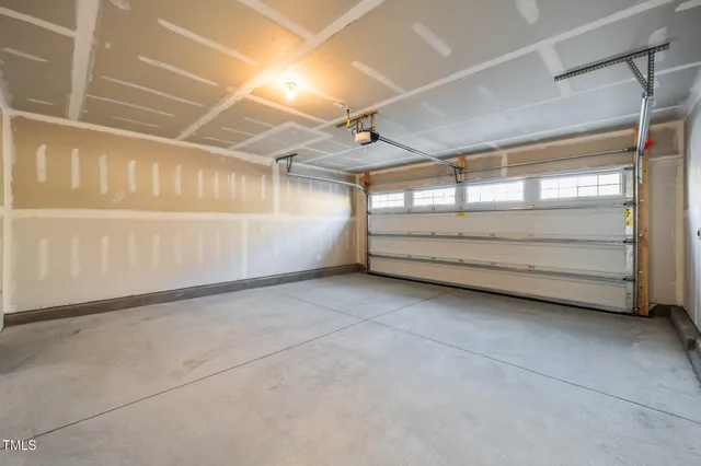 a view of a balcony with wooden floor and fence