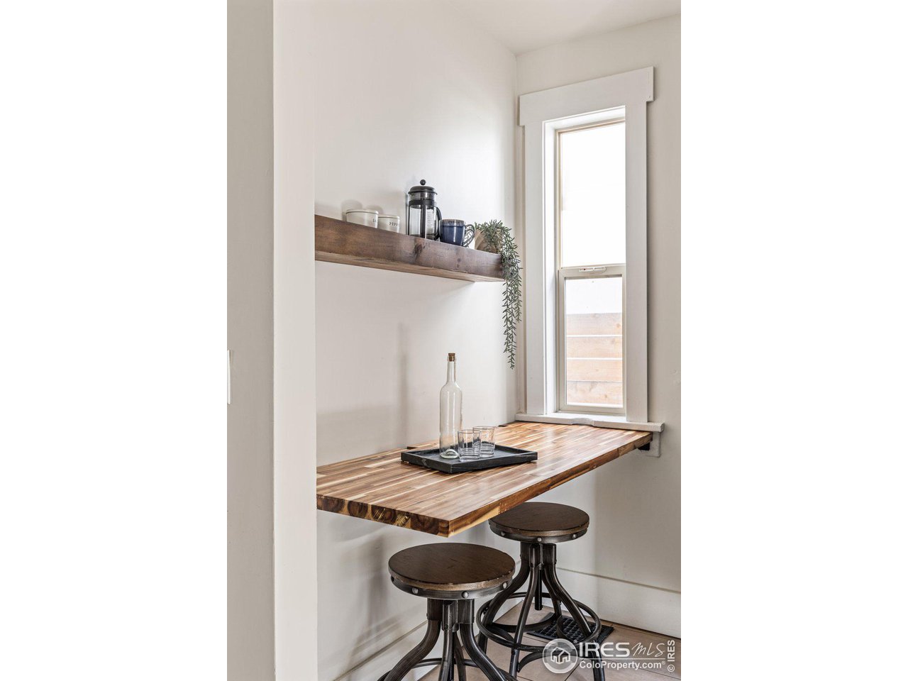 4464 Raleigh Street Denver, CO 80212 - Photo 14 of 39 a room with a table and chairs in it