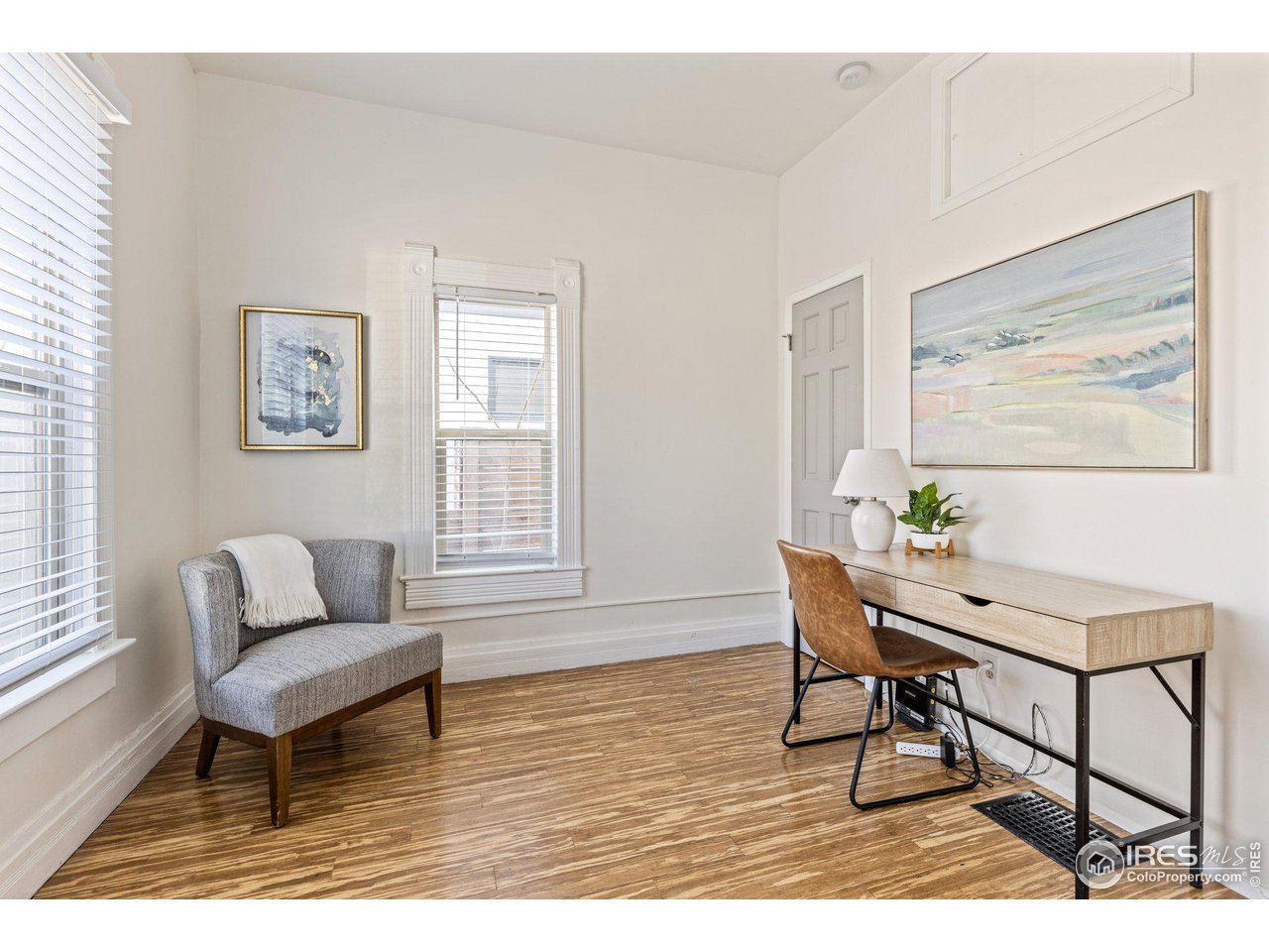 4464 Raleigh Street Denver, CO 80212 - Photo 18 of 39 a living room with furniture and wooden floor
