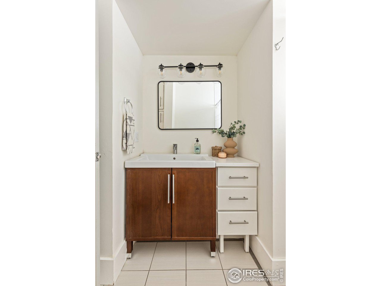 4464 Raleigh Street Denver, CO 80212 - Photo 19 of 39 a bathroom with a sink and a mirror
