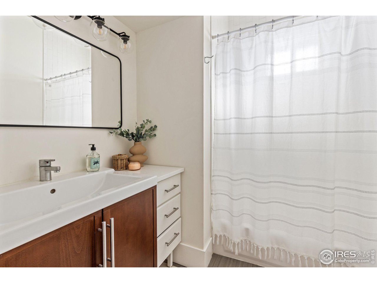 4464 Raleigh Street Denver, CO 80212 - Photo 20 of 39 a bathroom with a sink and a mirror