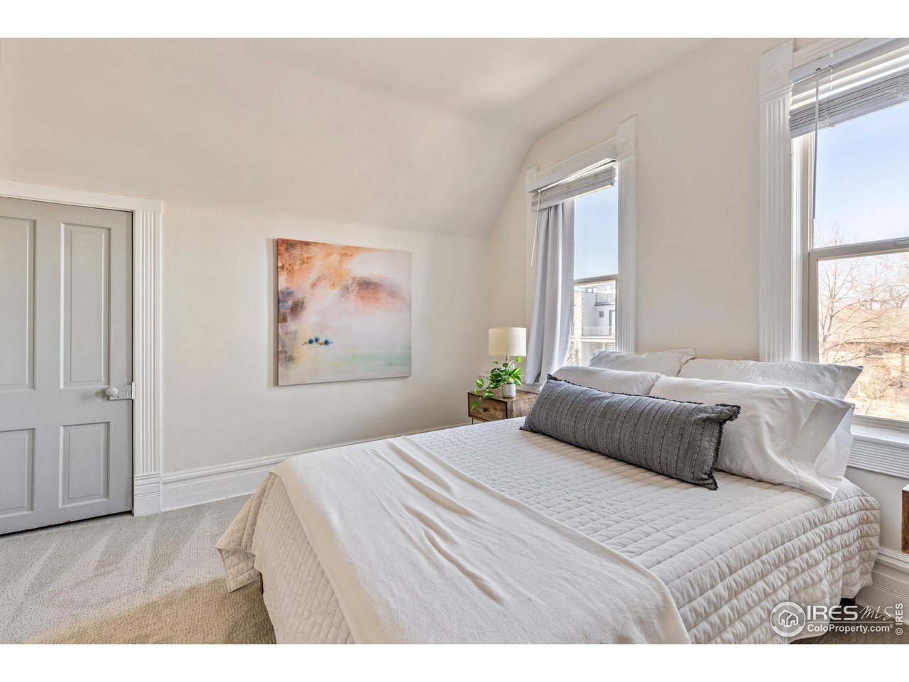 4464 Raleigh Street Denver, CO 80212 - Photo 31 of 39 a bedroom with a large bed and a window