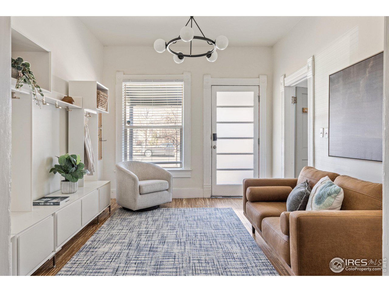 4464 Raleigh Street Denver, CO 80212 - Photo 5 of 39 a living room with furniture and a large window