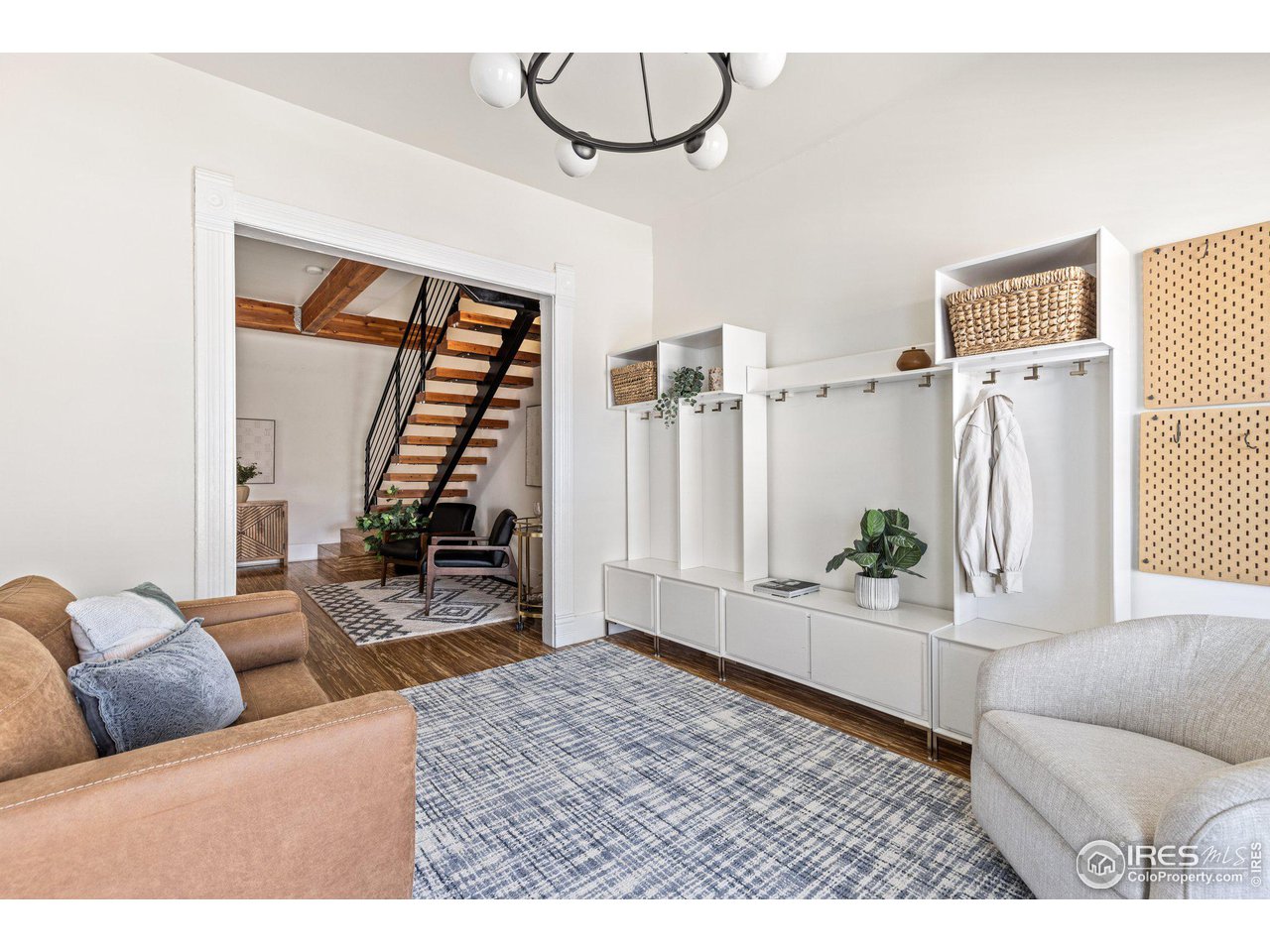 4464 Raleigh Street Denver, CO 80212 - Photo 7 of 39 a living room with furniture and a wooden floor