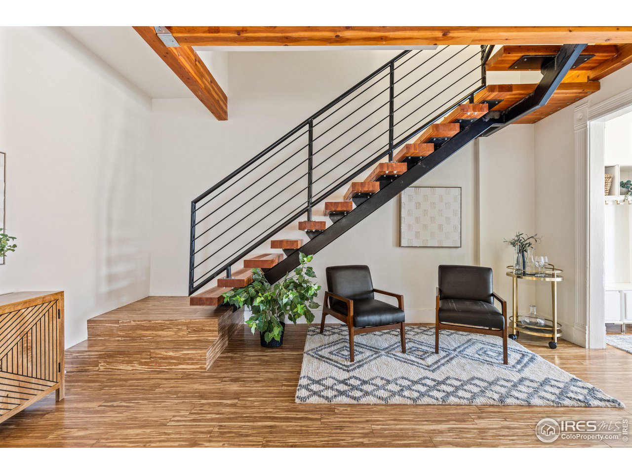 4464 Raleigh Street Denver, CO 80212 - Photo 9 of 39 a living room with furniture and a potted plant