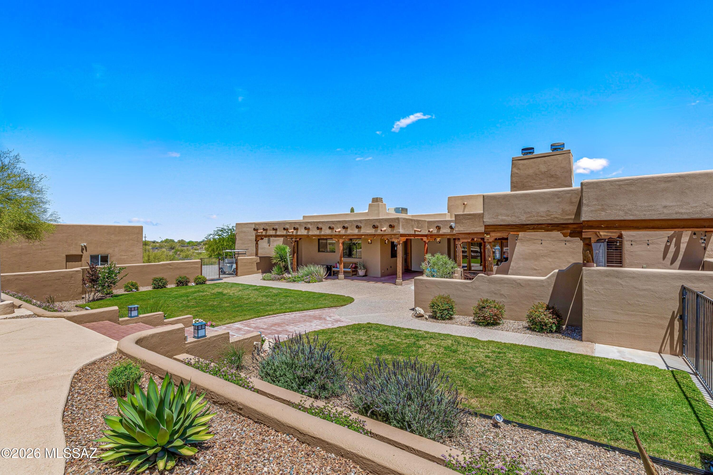 11160 East Golf Links Road Tucson, AZ 85730 - Photo 28 of 51 Nice patches of real grass, natural desert landscaping and a second fountain add to the serenity of the yard.