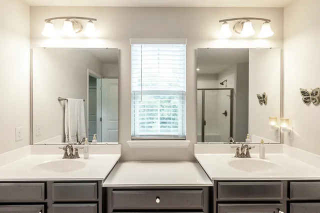 a bathroom with a shower and a tub