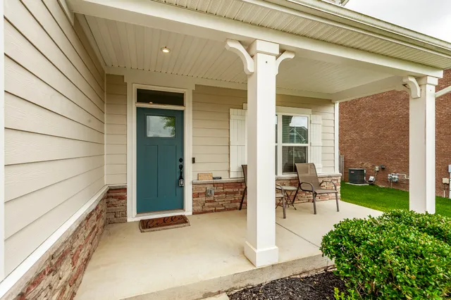 a view of a livingroom with workspace and a couch