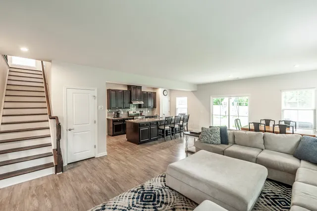 a view of a dining room with furniture and a window