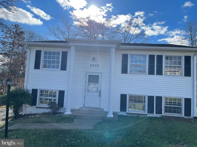 a view of a house with a garden and yard