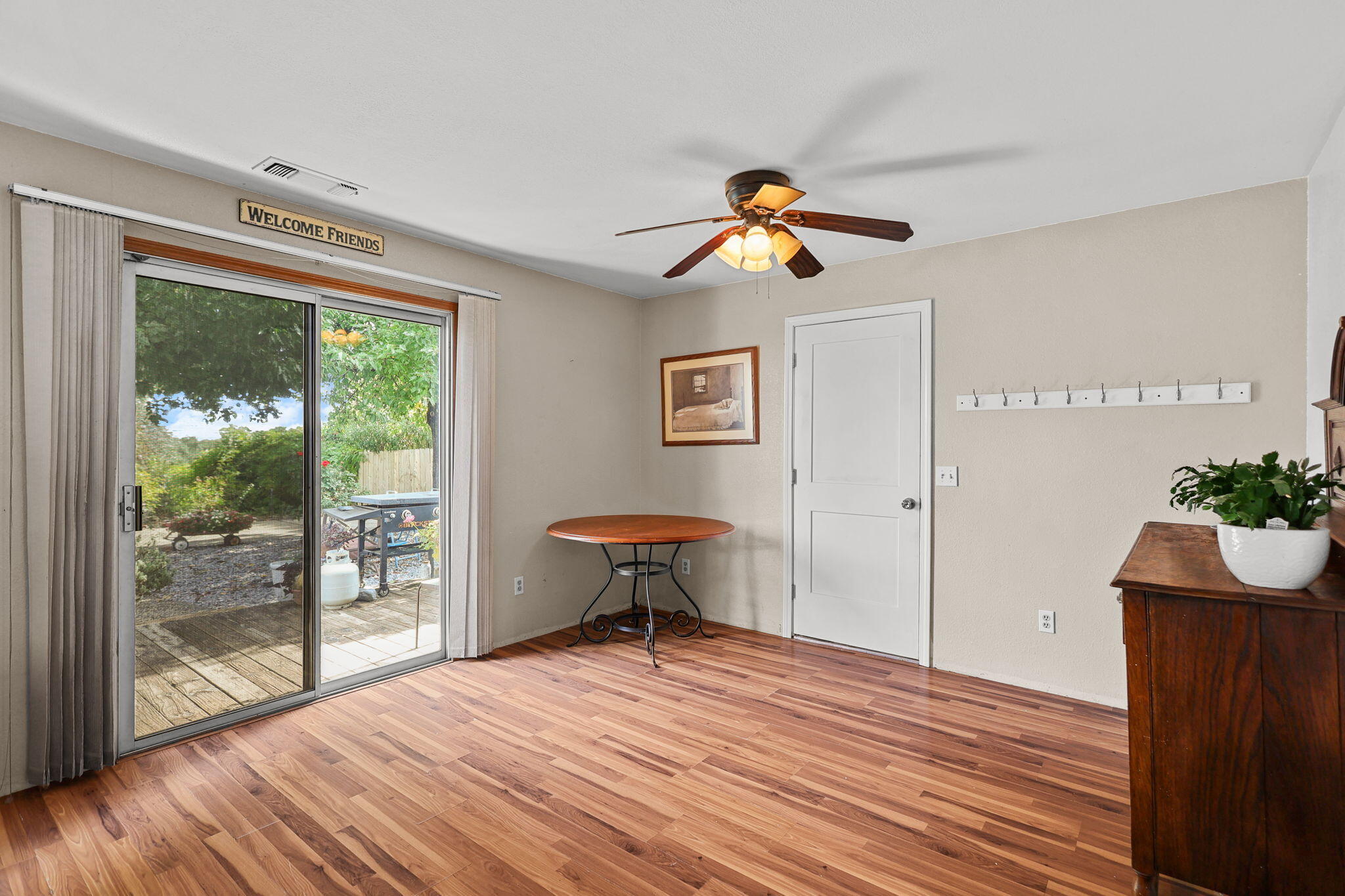 404 Woodhill Drive Redding, CA 96003 - Photo 11 of 52 a view of a livingroom with a window and wooden floor