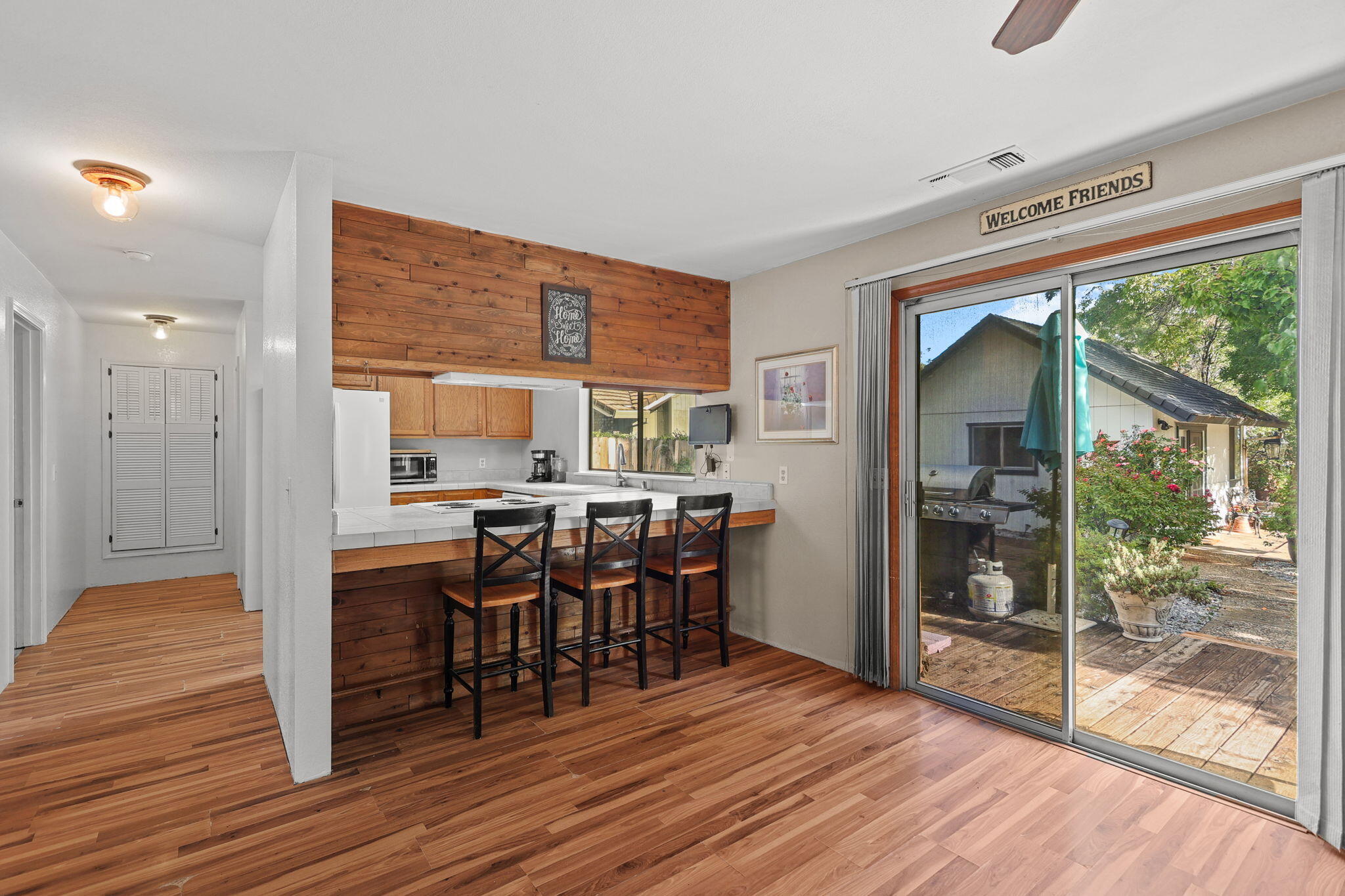 404 Woodhill Drive Redding, CA 96003 - Photo 13 of 52 a view of a dining room with furniture window and wooden floor