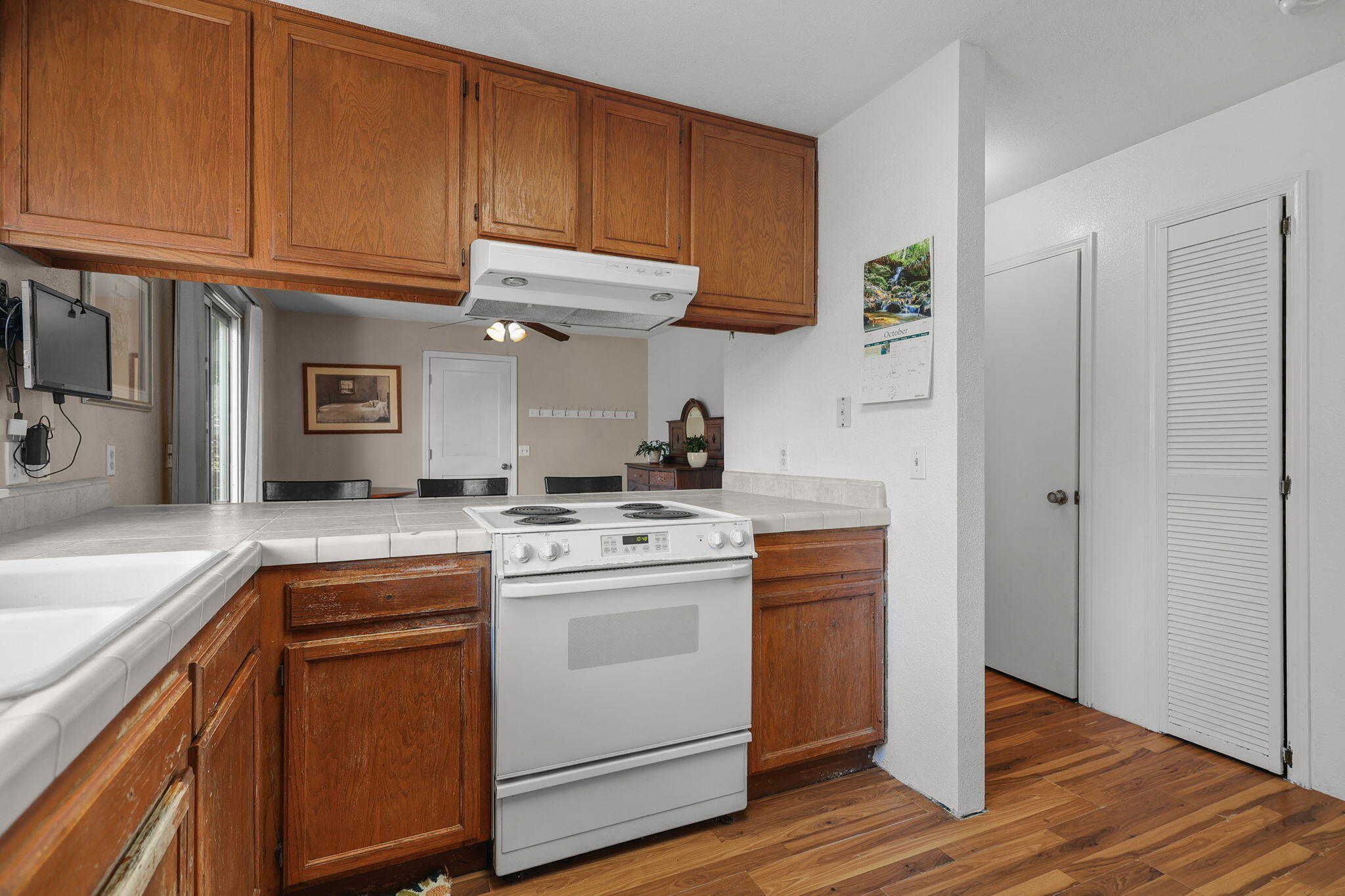 404 Woodhill Drive Redding, CA 96003 - Photo 15 of 52 a kitchen with stainless steel appliances granite countertop a sink a stove and cabinets