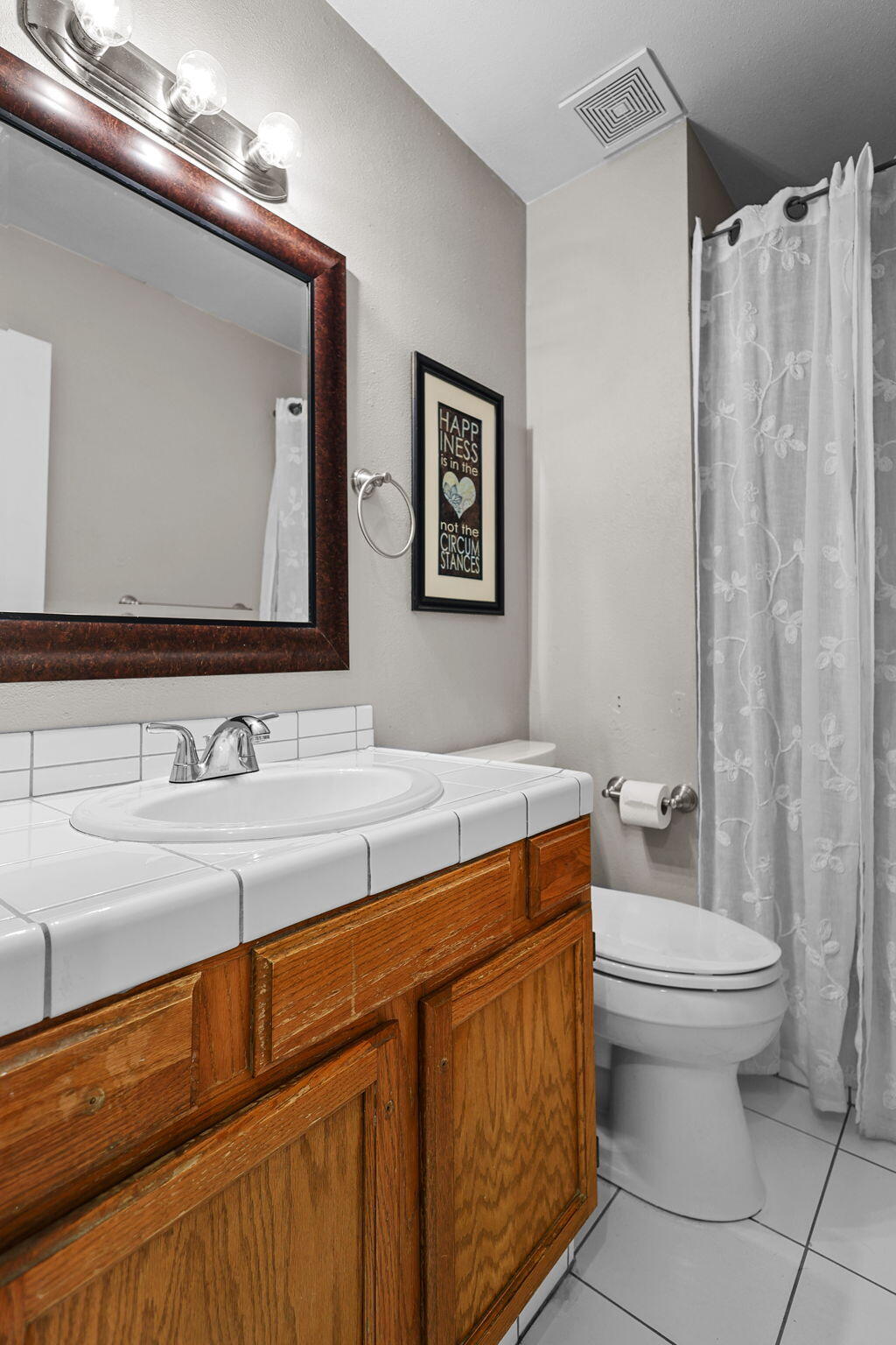 404 Woodhill Drive Redding, CA 96003 - Photo 18 of 52 a bathroom with a sink a toilet and mirror