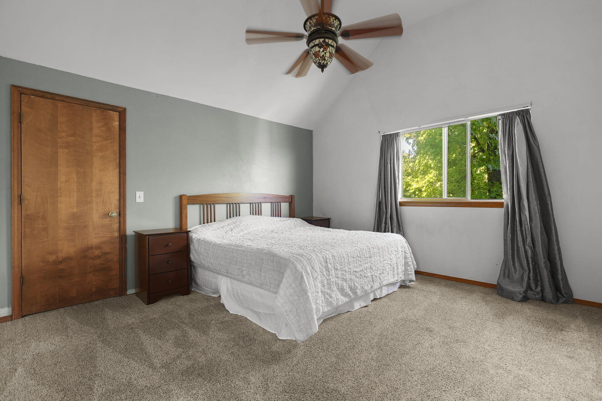 404 Woodhill Drive Redding, CA 96003 - Photo 19 of 52 a bedroom with a bed and a window