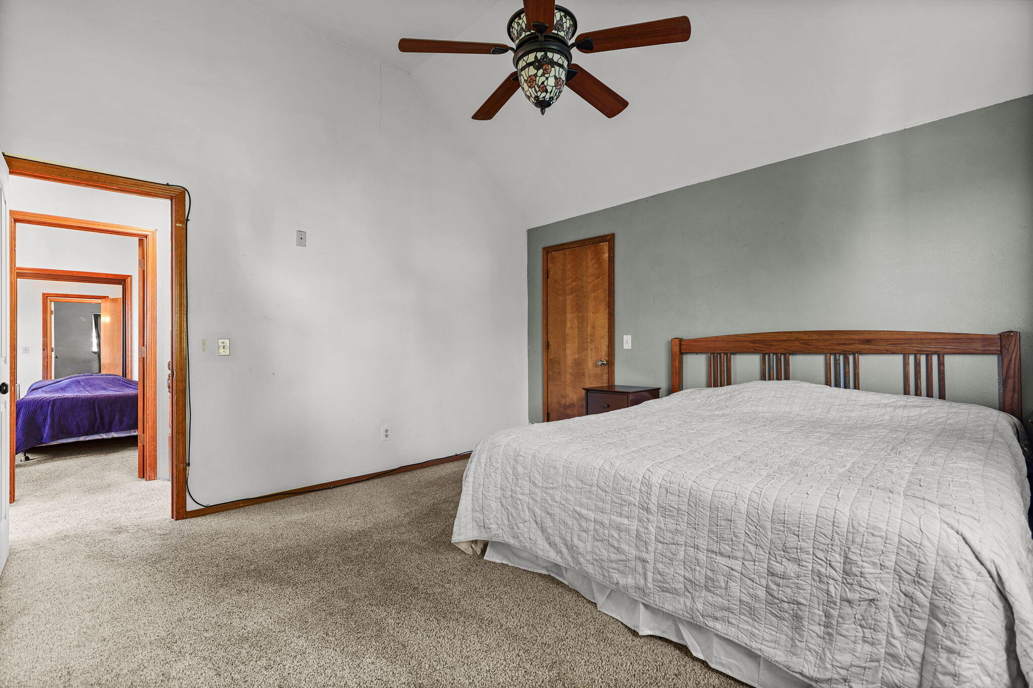 404 Woodhill Drive Redding, CA 96003 - Photo 20 of 52 a bedroom with a bed and closet