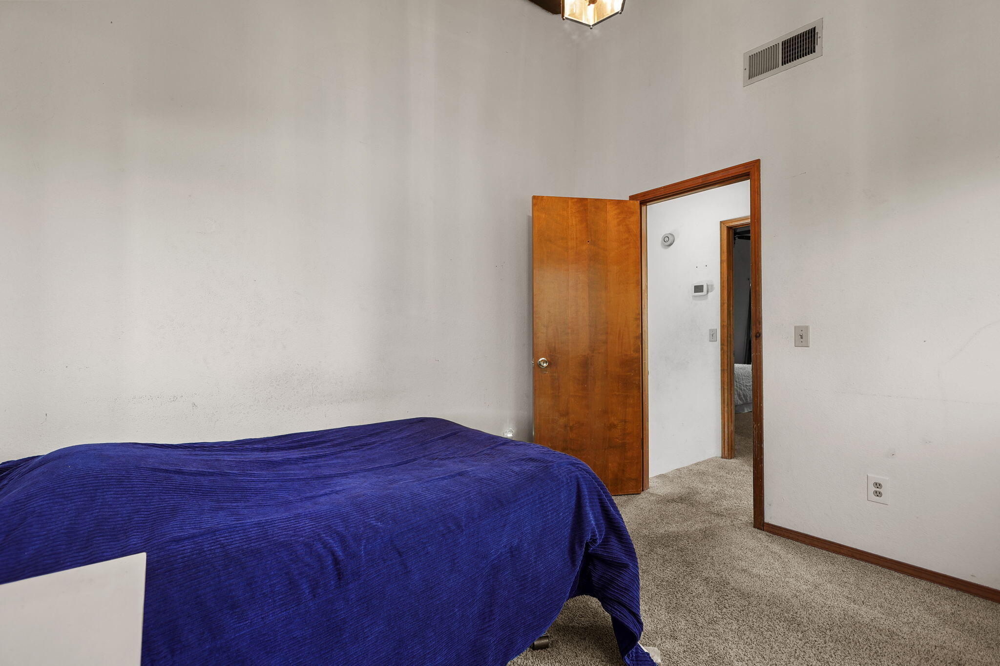 404 Woodhill Drive Redding, CA 96003 - Photo 23 of 52 a bedroom with a bed and a closet