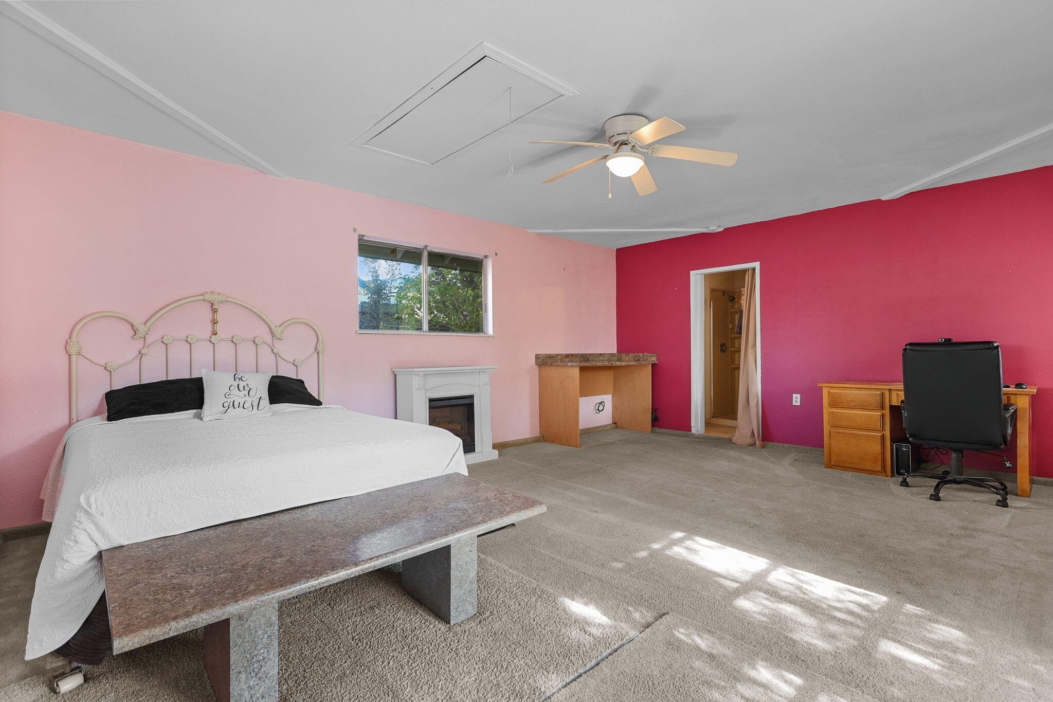 404 Woodhill Drive Redding, CA 96003 - Photo 27 of 52 a bed room with a bed and a chandelier