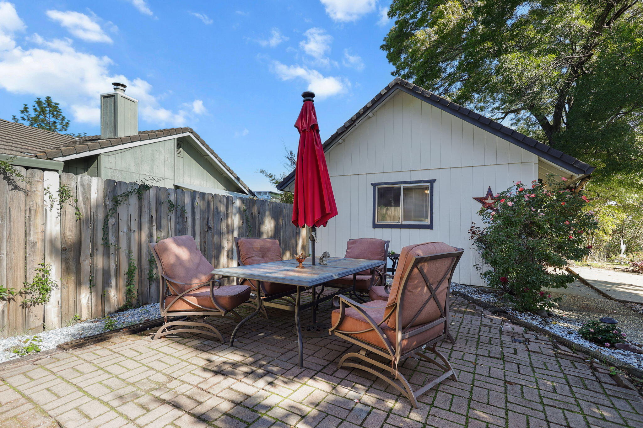 404 Woodhill Drive Redding, CA 96003 - Photo 31 of 52 a view of a house with backyard and sitting area