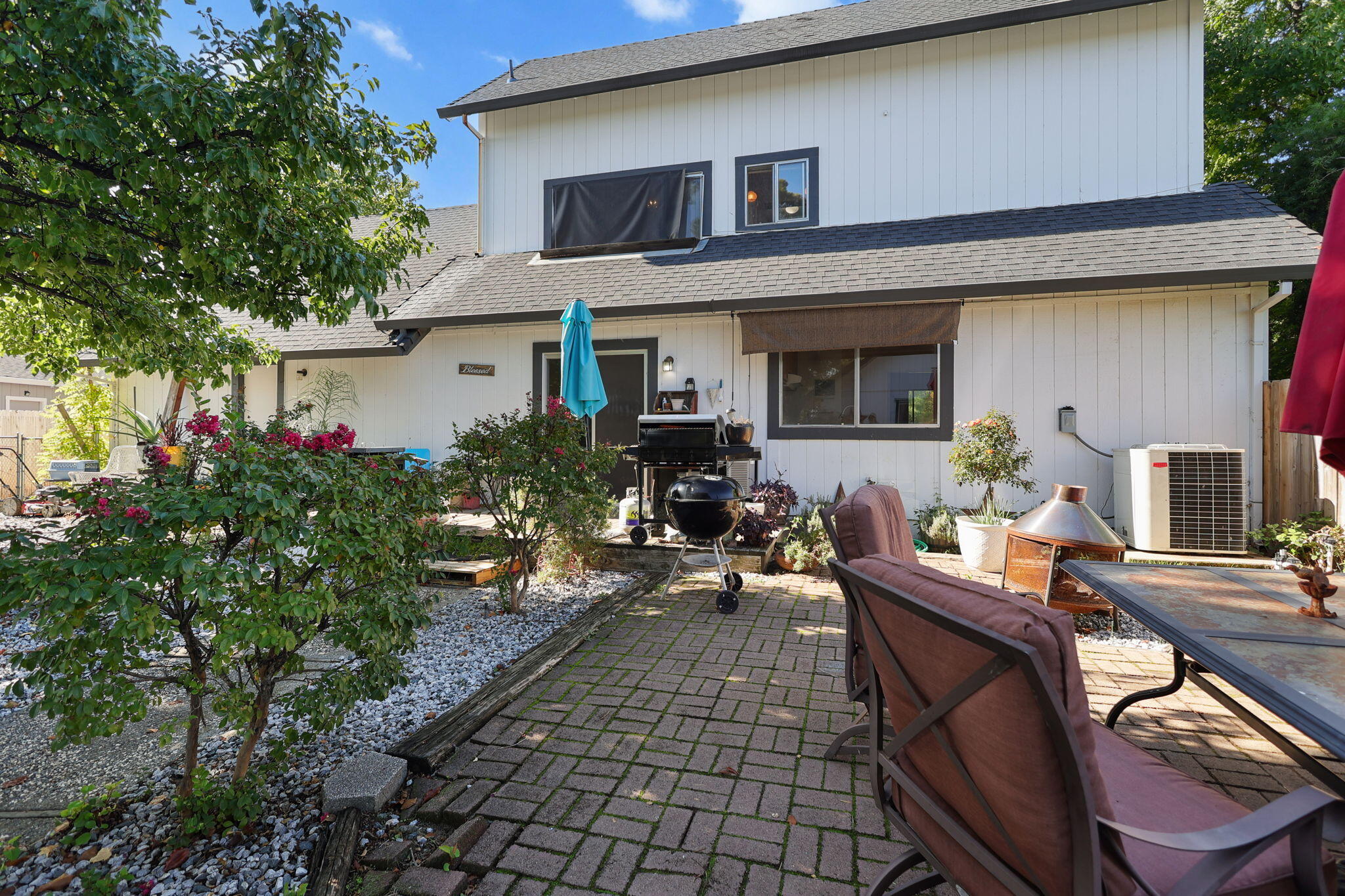 404 Woodhill Drive Redding, CA 96003 - Photo 32 of 52 a view of a house with patio