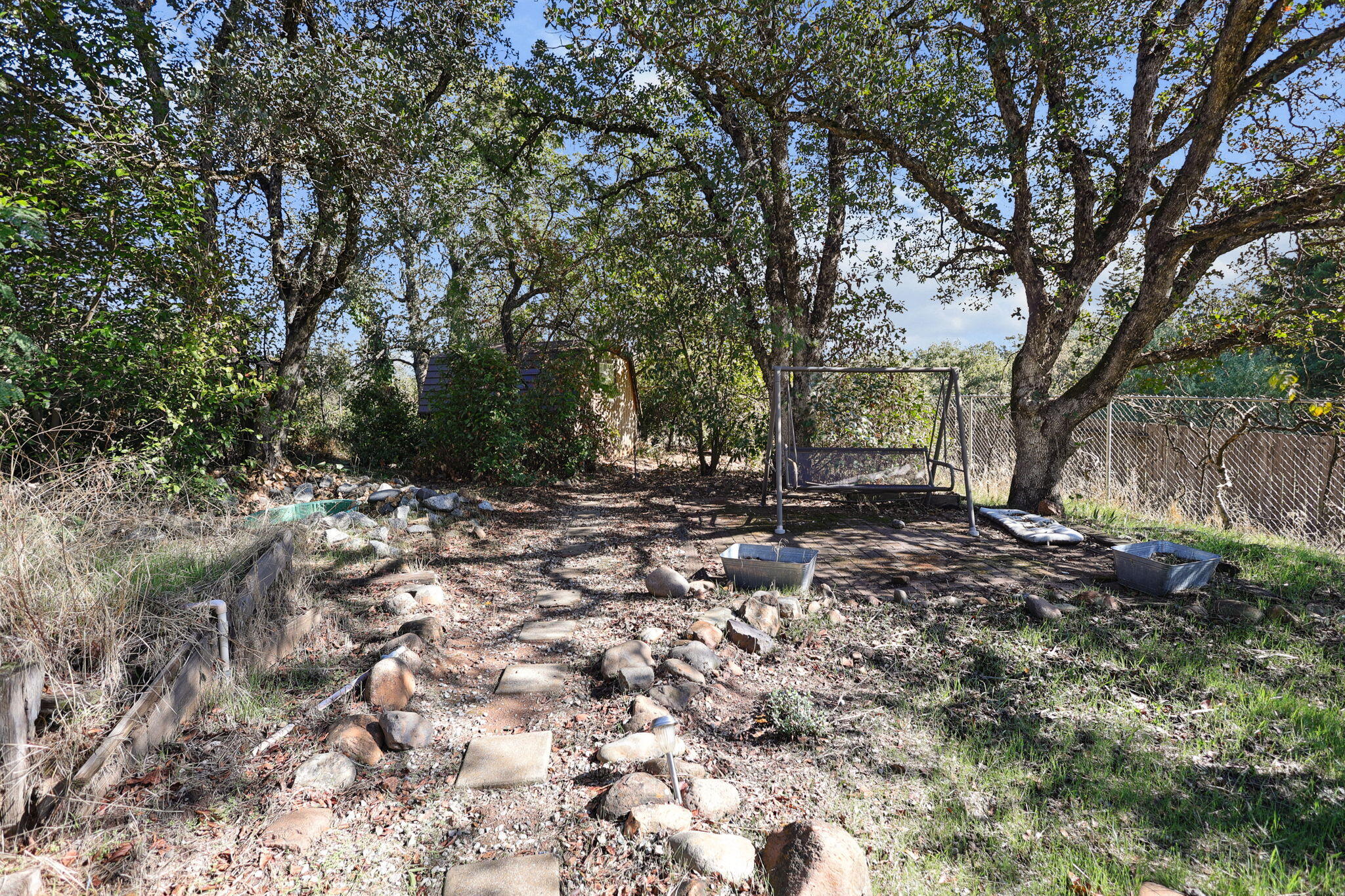 404 Woodhill Drive Redding, CA 96003 - Photo 33 of 52 a view of outdoor space with trees