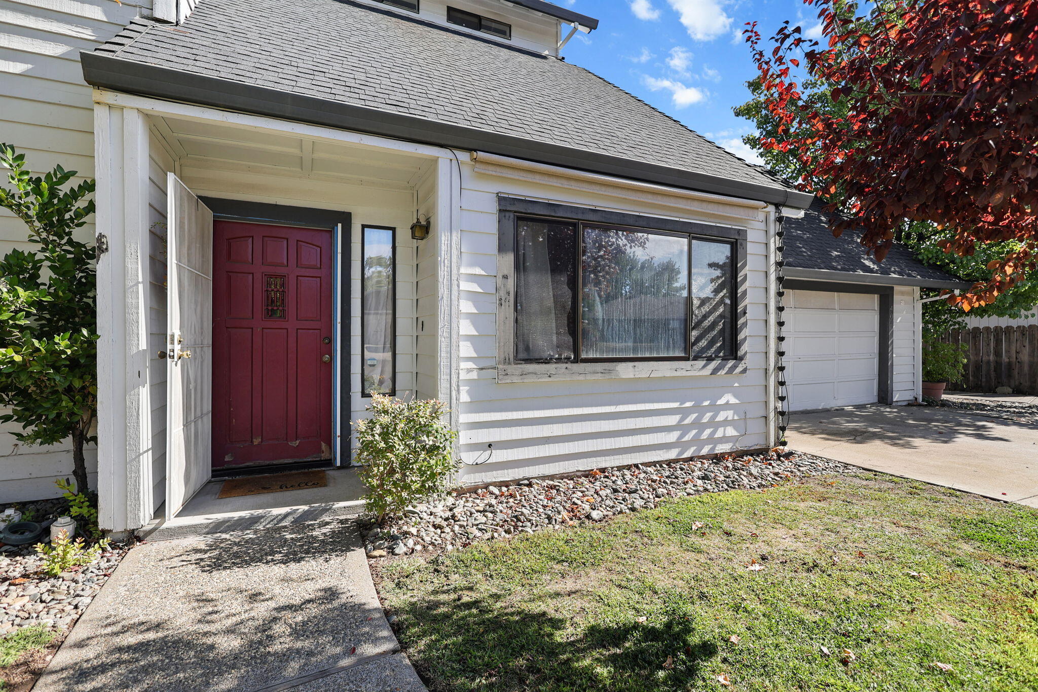 404 Woodhill Drive Redding, CA 96003 - Photo 35 of 52 a front view of a house with a garden