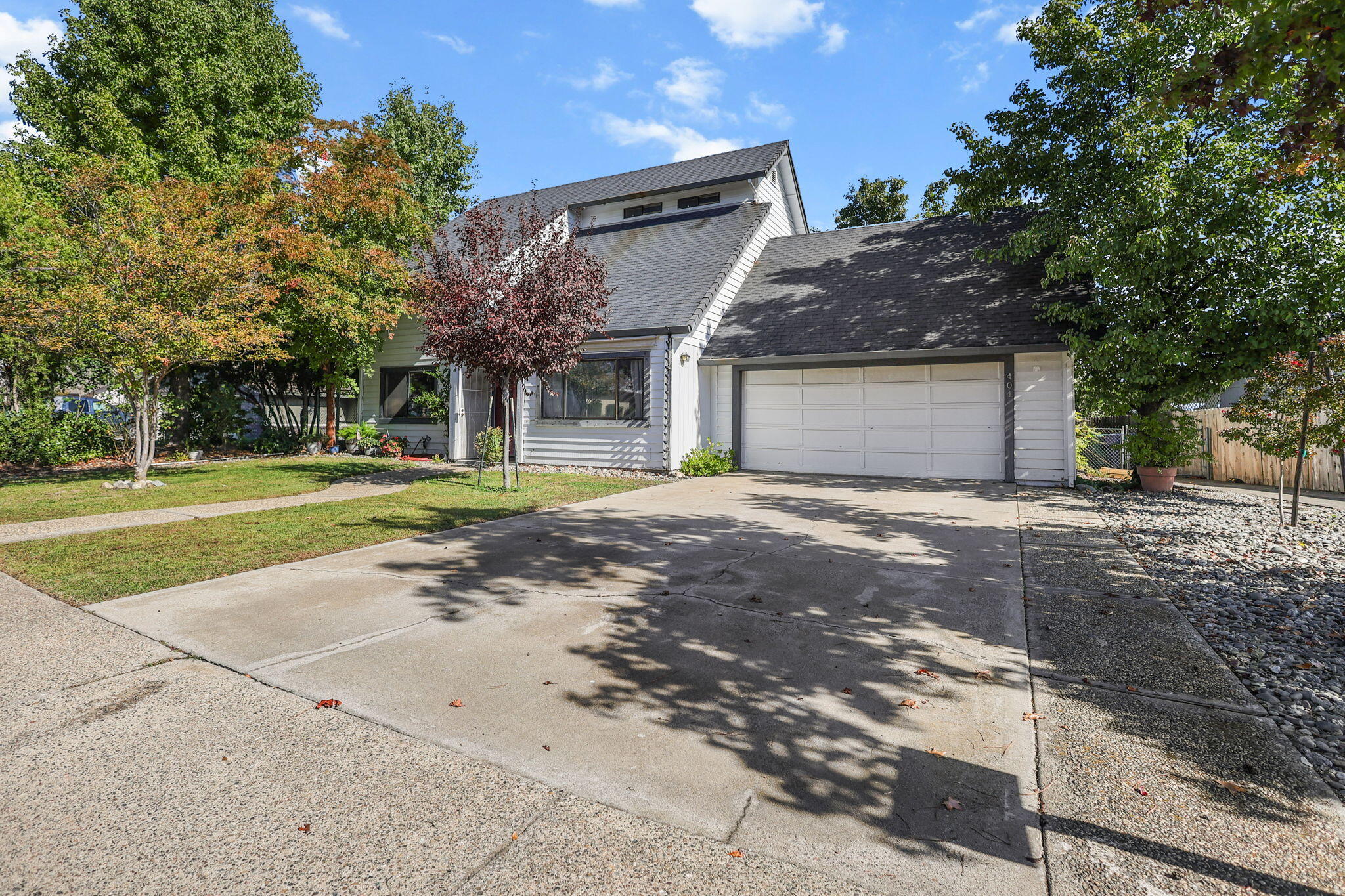 404 Woodhill Drive Redding, CA 96003 - Photo 36 of 52 a front view of a house with a yard