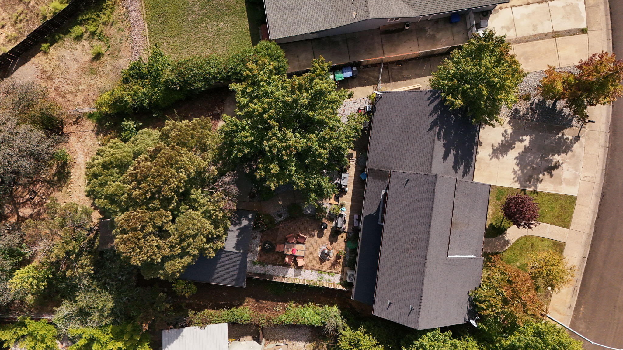 404 Woodhill Drive Redding, CA 96003 - Photo 39 of 52 an aerial view of a house with a yard and large tree