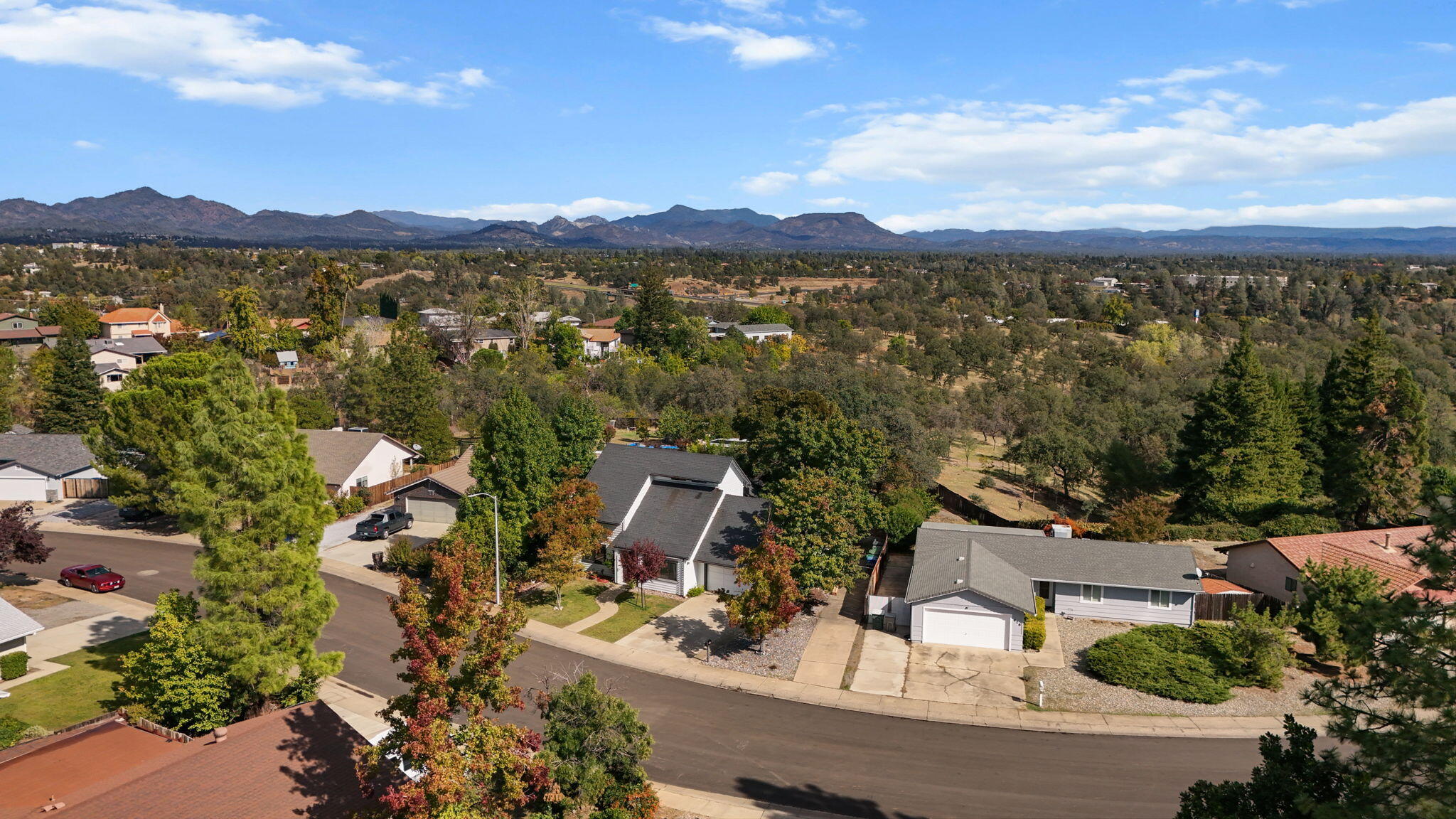 404 Woodhill Drive Redding, CA 96003 - Photo 41 of 52 aerial view of a house with mountain view