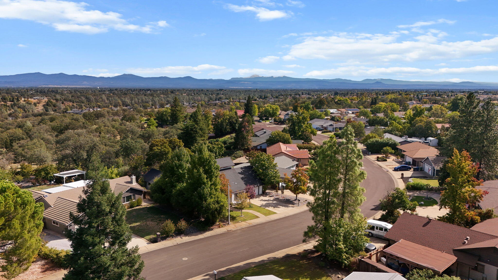 404 Woodhill Drive Redding, CA 96003 - Photo 42 of 52 an aerial view of residential houses with outdoor space
