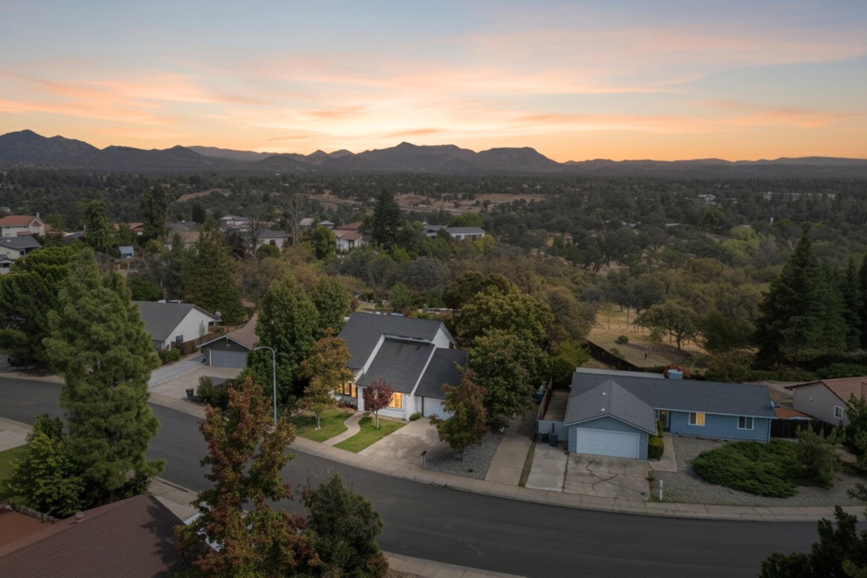 404 Woodhill Drive Redding, CA 96003 - Photo 6 of 52 an aerial view of residential houses with outdoor space and trees