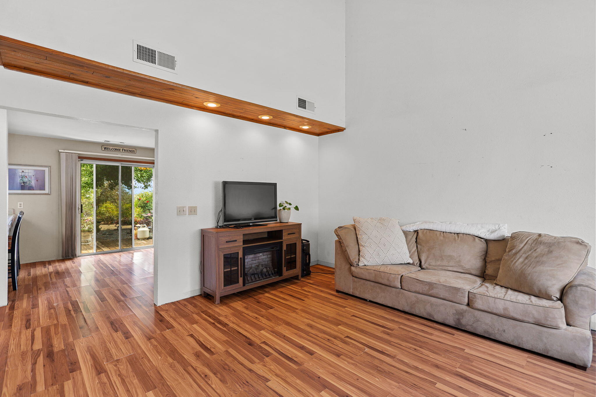 404 Woodhill Drive Redding, CA 96003 - Photo 8 of 52 a living room with furniture and a flat screen tv