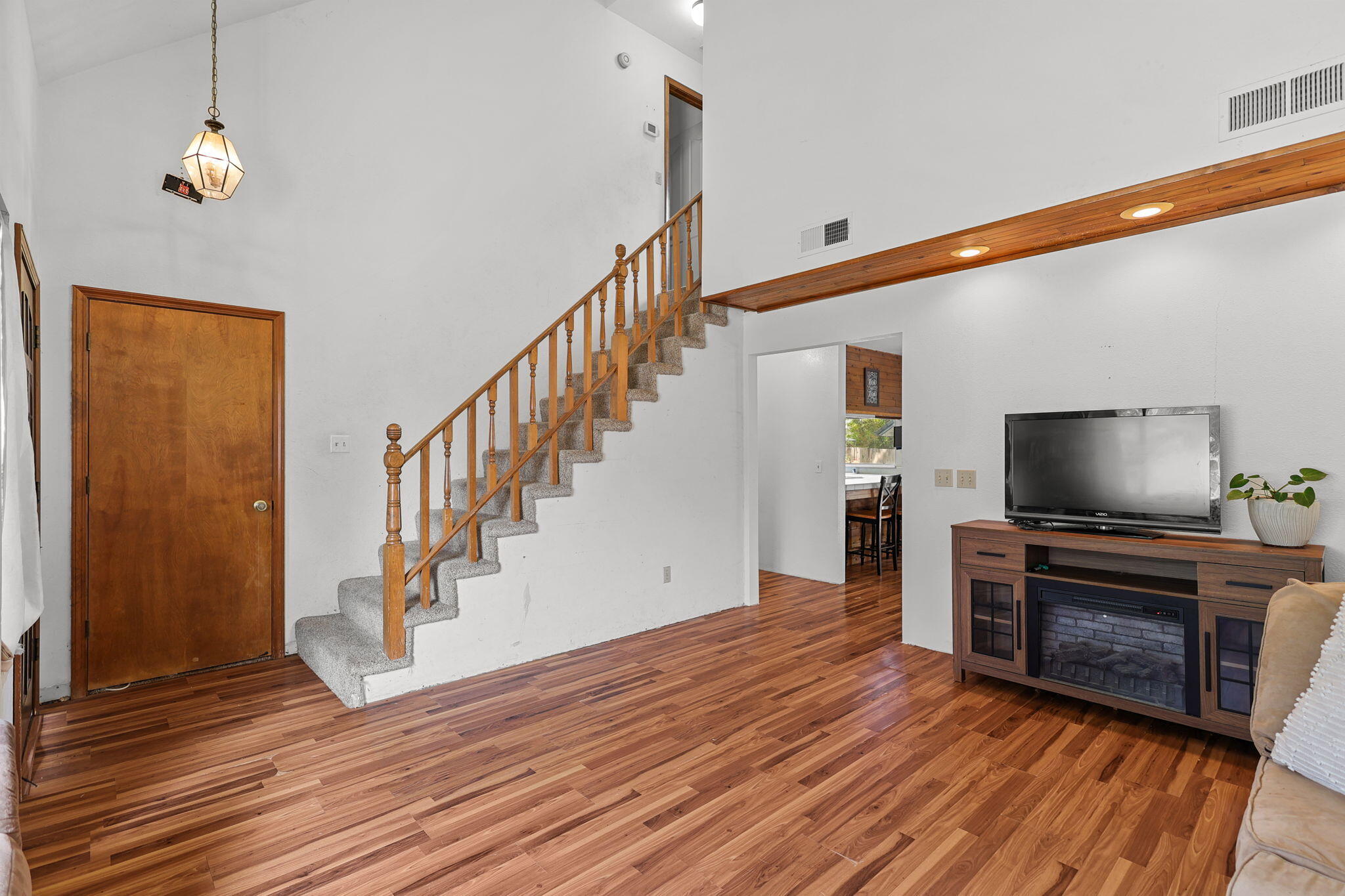 404 Woodhill Drive Redding, CA 96003 - Photo 9 of 52 a view of a livingroom with wooden floor and staircase
