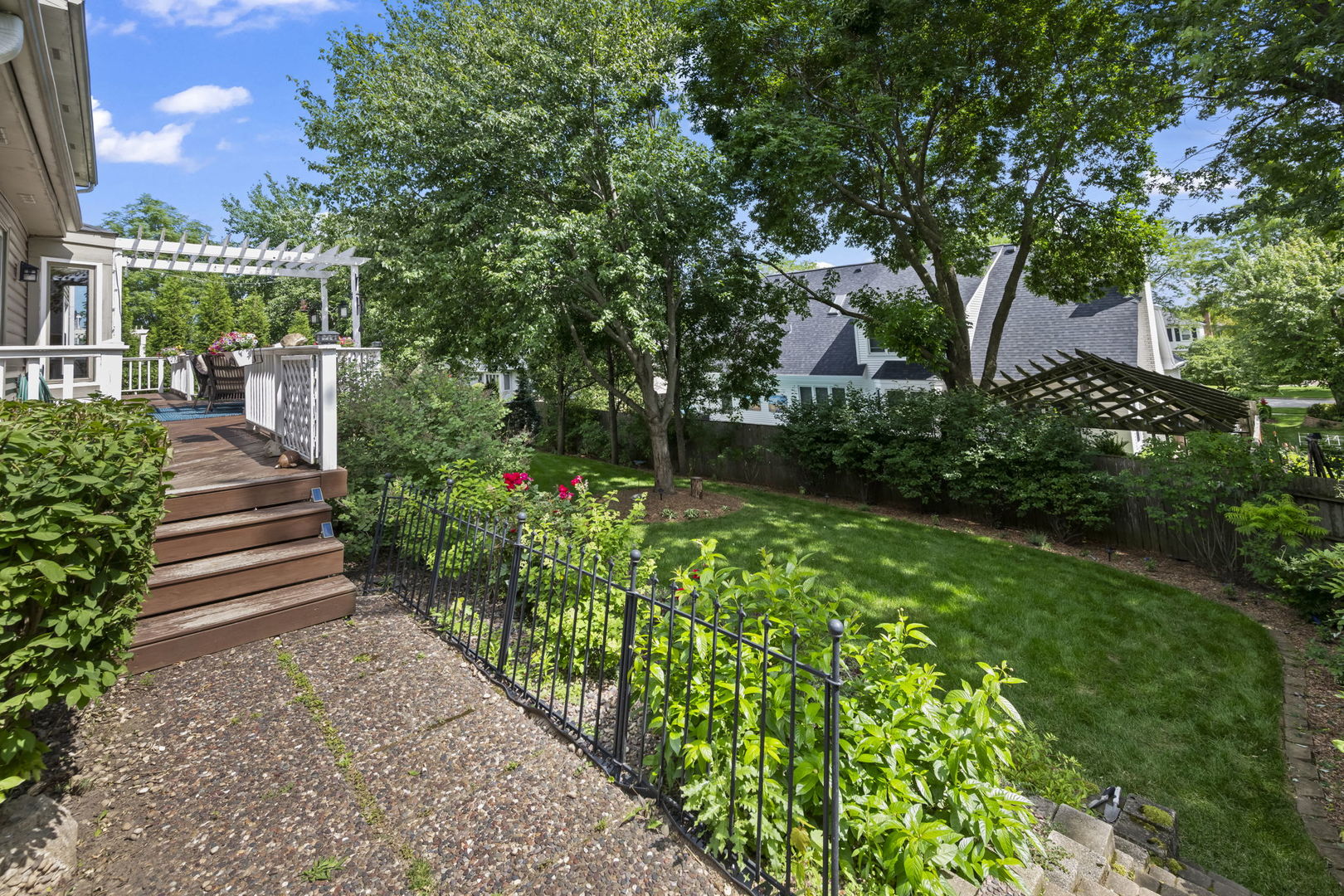 1565 Freeman Road Hoffman Estates, IL 60192 - Photo 4 of 46 a view of a garden with pathway