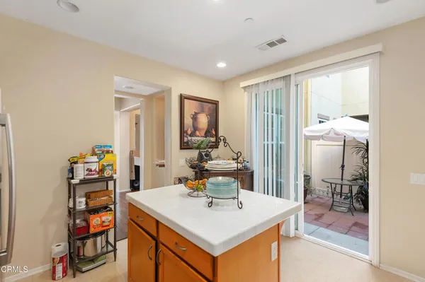 a view of kitchen island with furniture and wooden floor