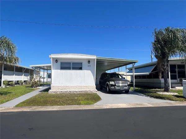 a view of a car in front of a house