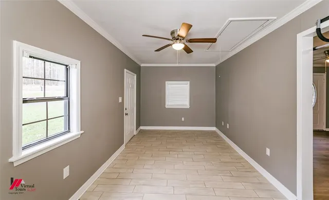 a view of an empty room with a window