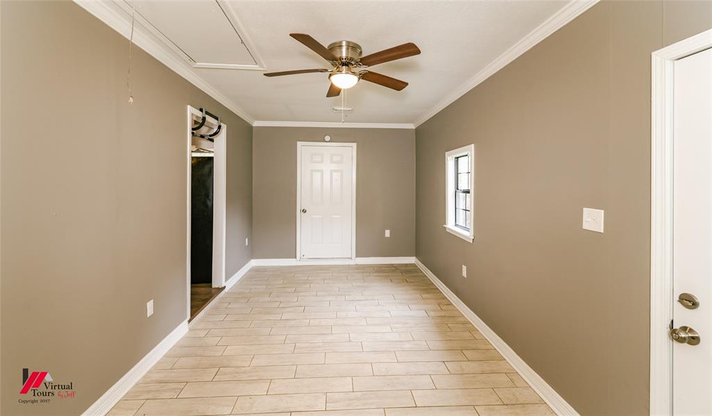 198 7 Pines Road Benton, LA 71006 - Photo 15 of 30 a view of an empty room with a ceiling fan and a window