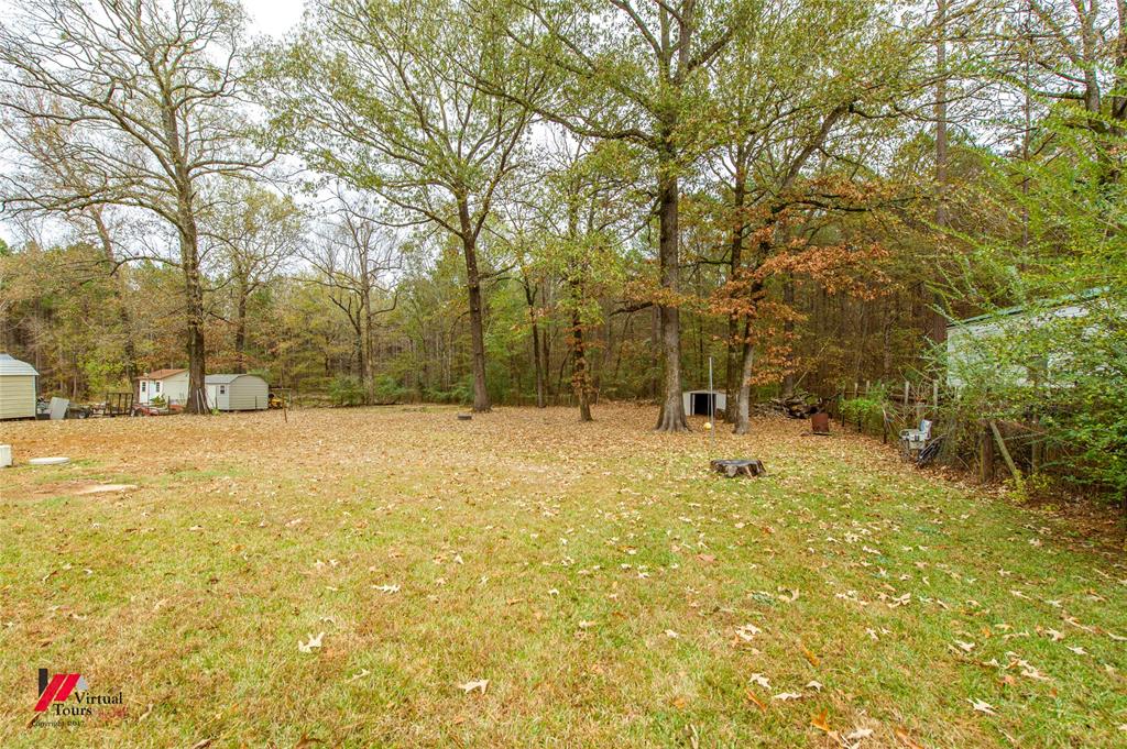 198 7 Pines Road Benton, LA 71006 - Photo 29 of 30 a view of yard covered with trees