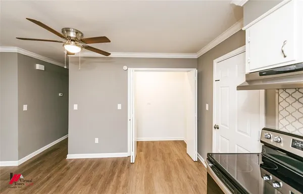 a view of a livingroom with wooden floor