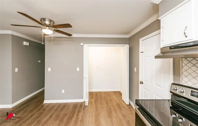 a view of a livingroom with wooden floor