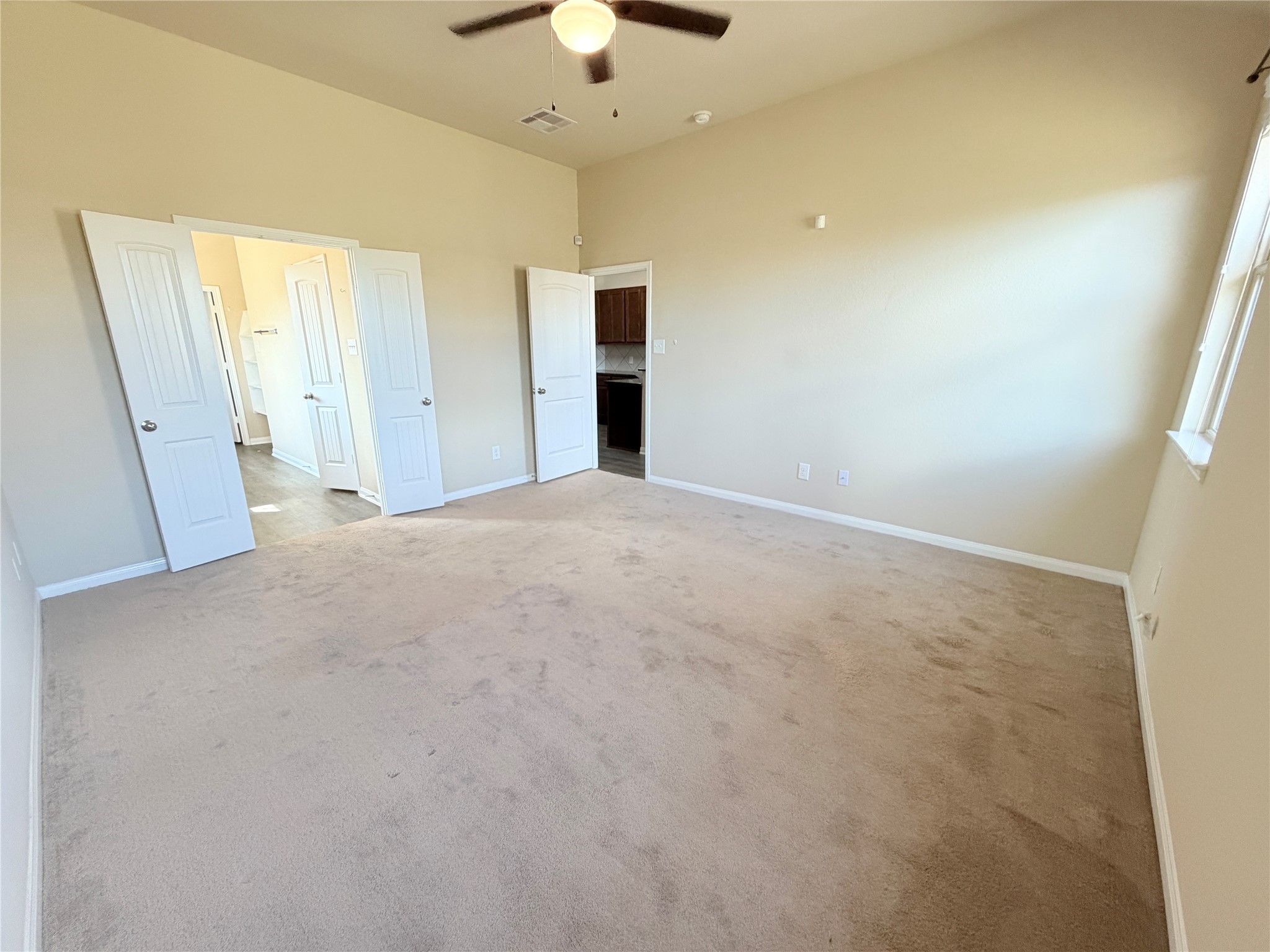 15613 All Star Drive Splendora, TX 77372 - Photo 12 of 25 en empty room with a ceiling fan and a window