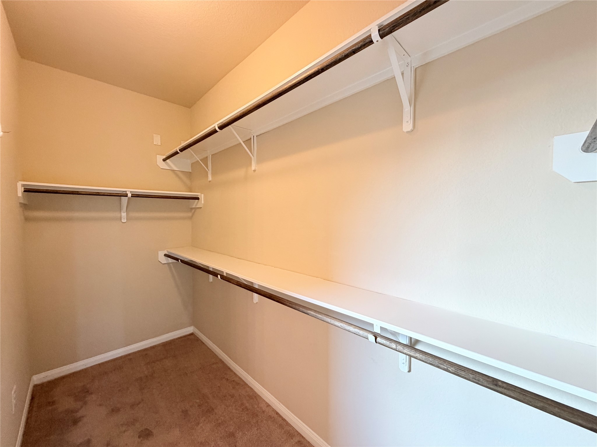 15613 All Star Drive Splendora, TX 77372 - Photo 15 of 25 a view of a room with racks on the wall