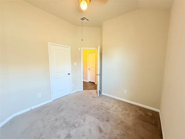 an empty room with a bathroom