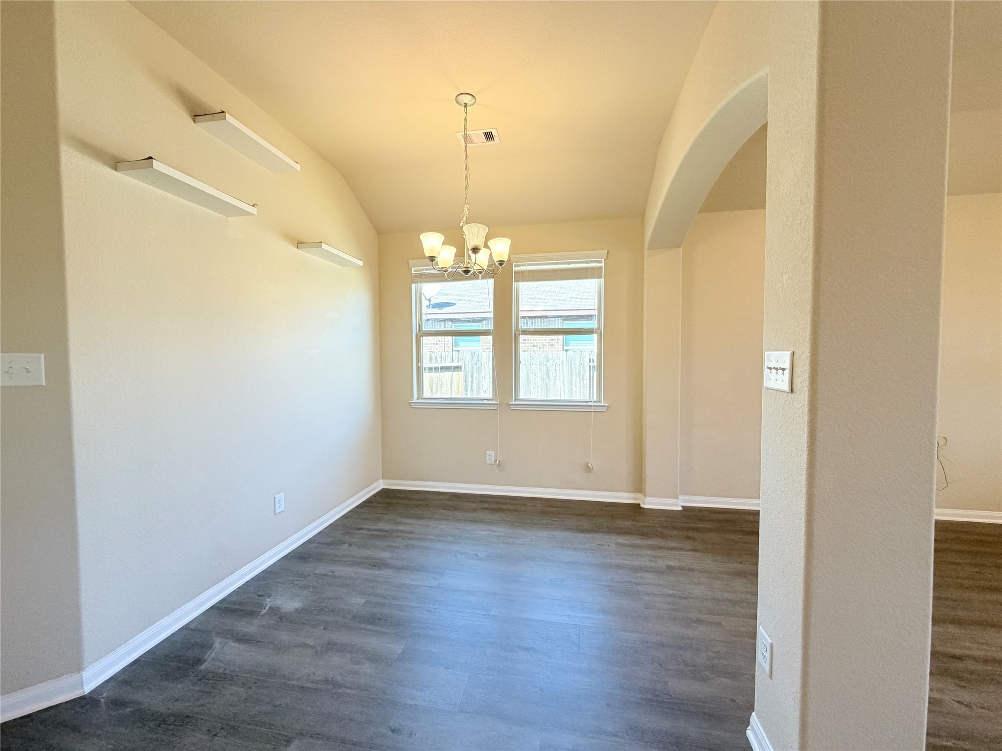 15613 All Star Drive Splendora, TX 77372 - Photo 4 of 25 an empty room with wooden floor and windows