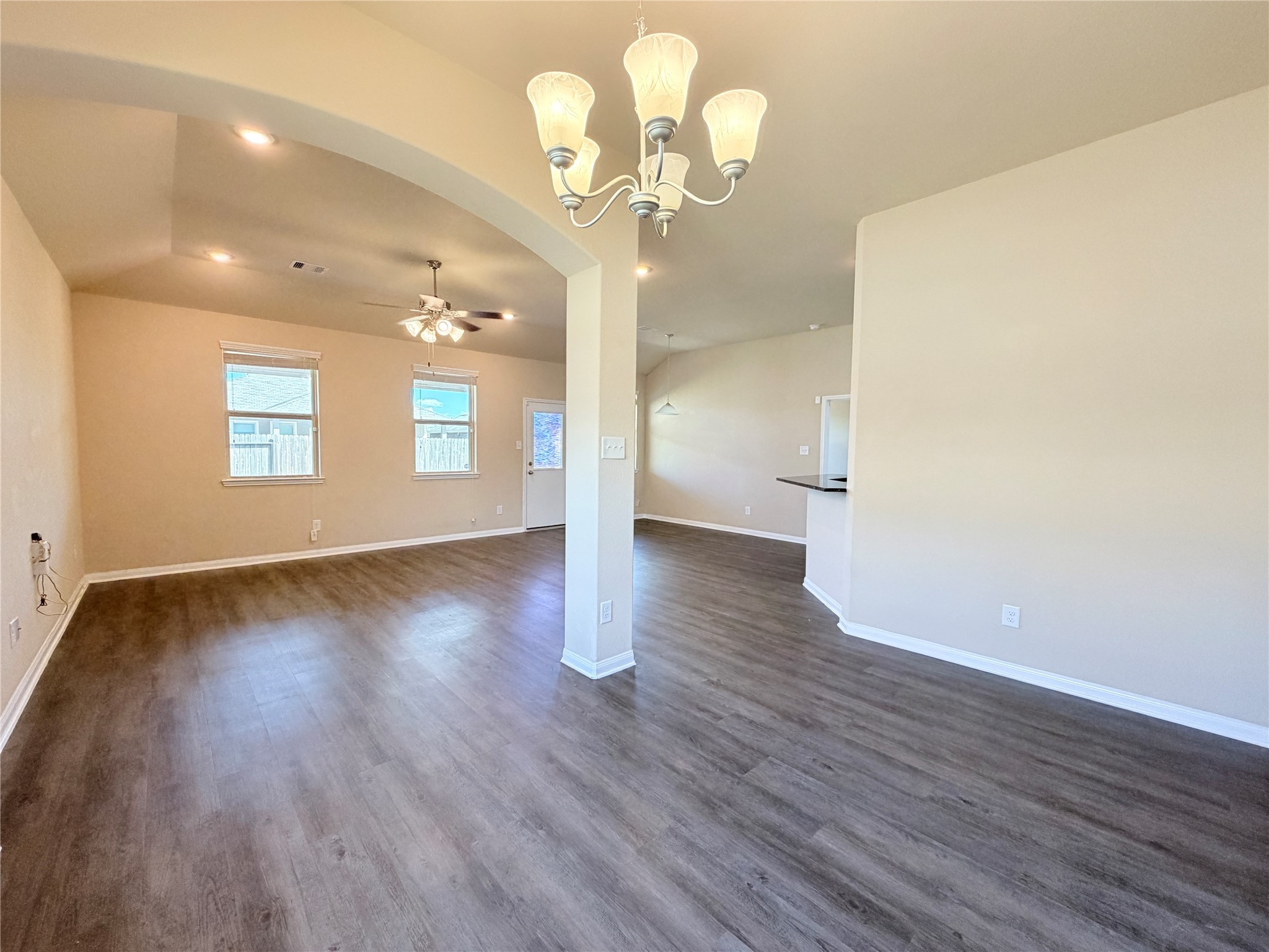 15613 All Star Drive Splendora, TX 77372 - Photo 5 of 25 a view of an empty room with wooden floor and a window