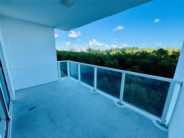 a view of balcony with furniture