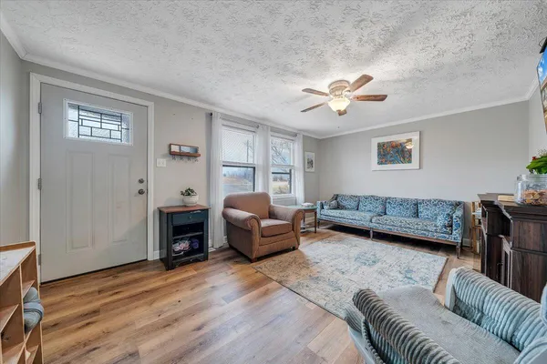 a living room with furniture and a fireplace