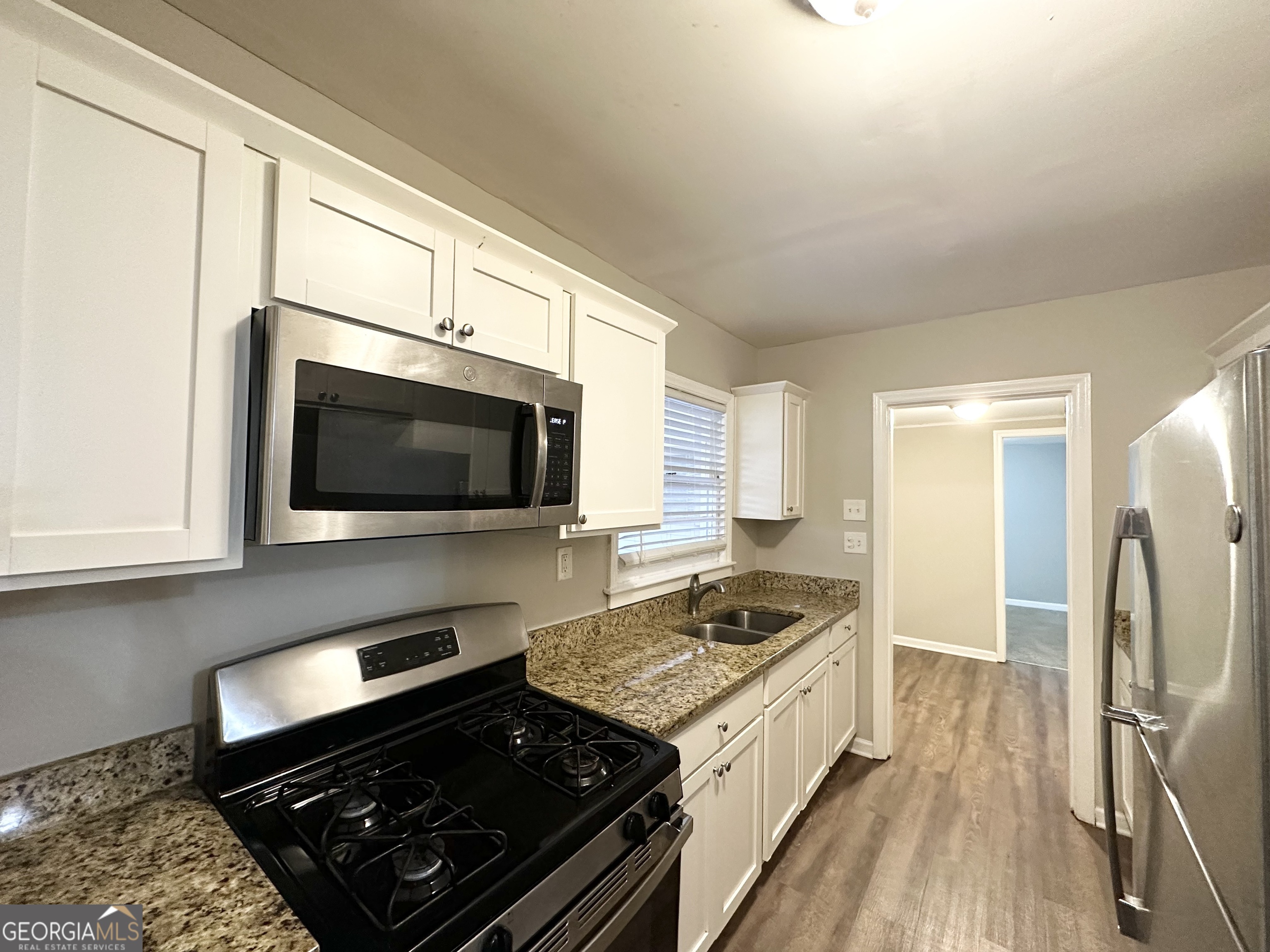 3011 Belvedere Lane Decatur, GA 30032 - Photo 6 of 13 a kitchen with a stove and a microwave