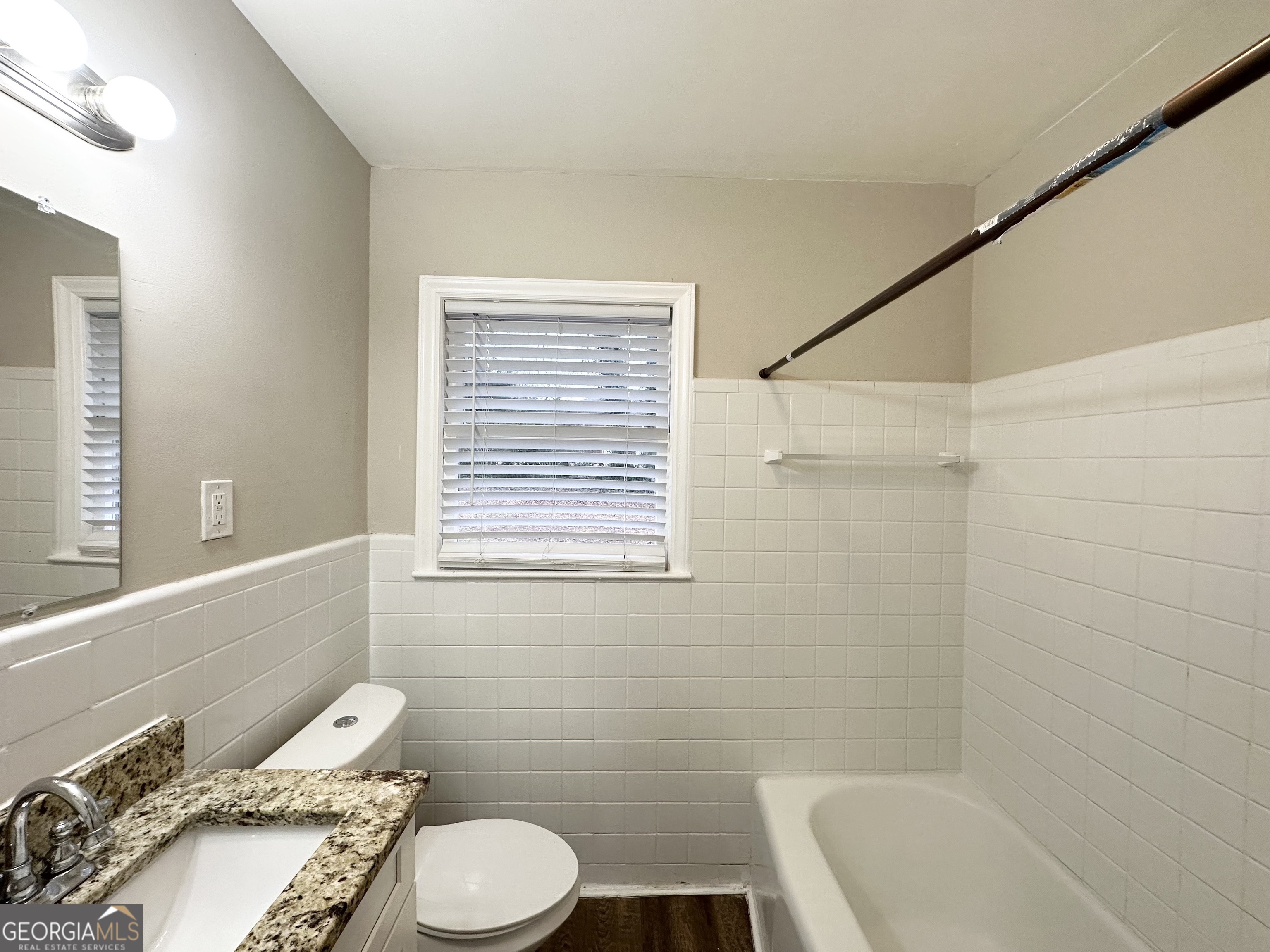 3011 Belvedere Lane Decatur, GA 30032 - Photo 10 of 13 a bathroom with a sink a toilet and shower